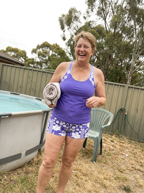 Woman wearing the Nina swimwear set by a backyard pool